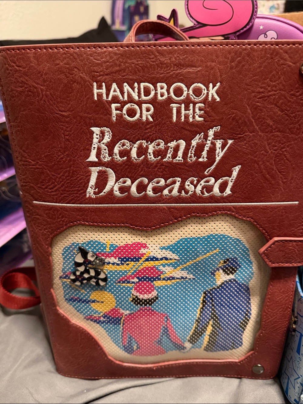 Loungefly Red 'Handbook for the Recently Deceased' Novelty Backpack